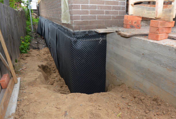 SJ Waterproofing Pros technician performing targeted Basement Waterproofing assessment in Parma, MI